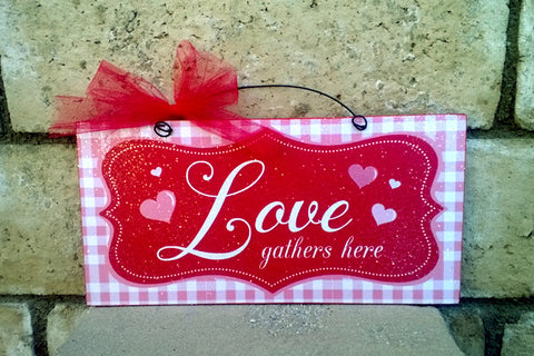 Love gathers here. Valentines sign.